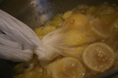 lemons in muslin bag in boiling jam